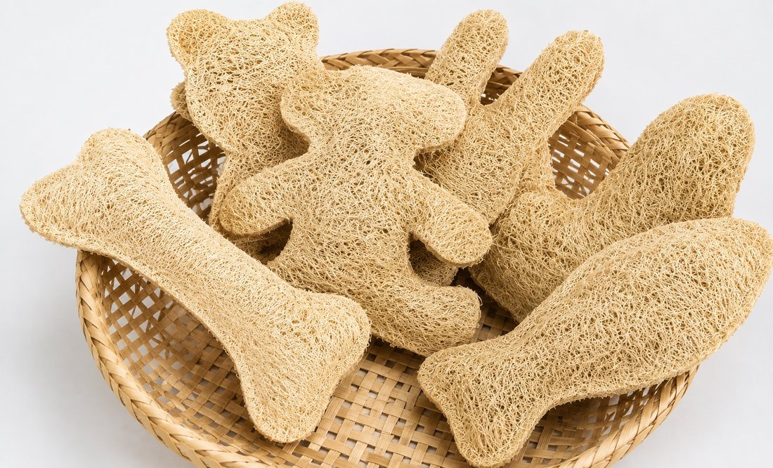Loofah toys shaped as a bone, cat, and mouse in a basket