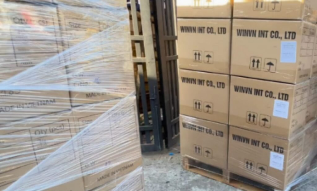 Wrapped pallets of export cartons marked WINVN INT CO., LTD and Made in Vietnam